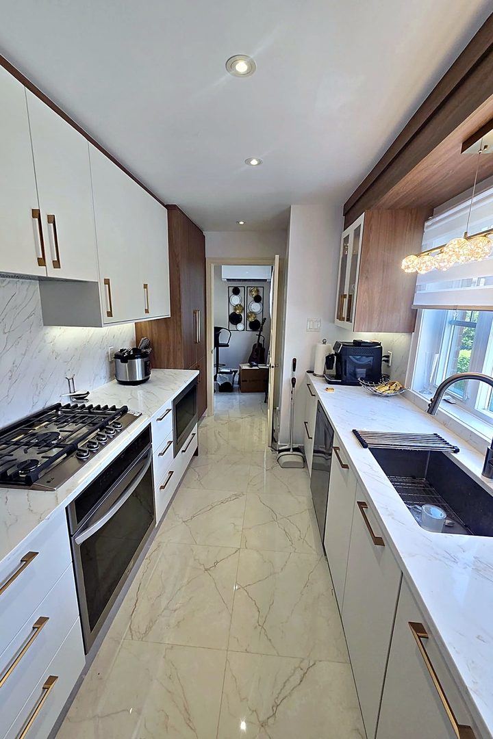 Square brass cabinet pulls in a kitchen